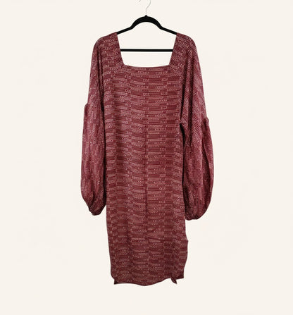 She Lives Beauty Desert Rain silk top in deep red with white geometric patterns, square neckline, and puff sleeves.