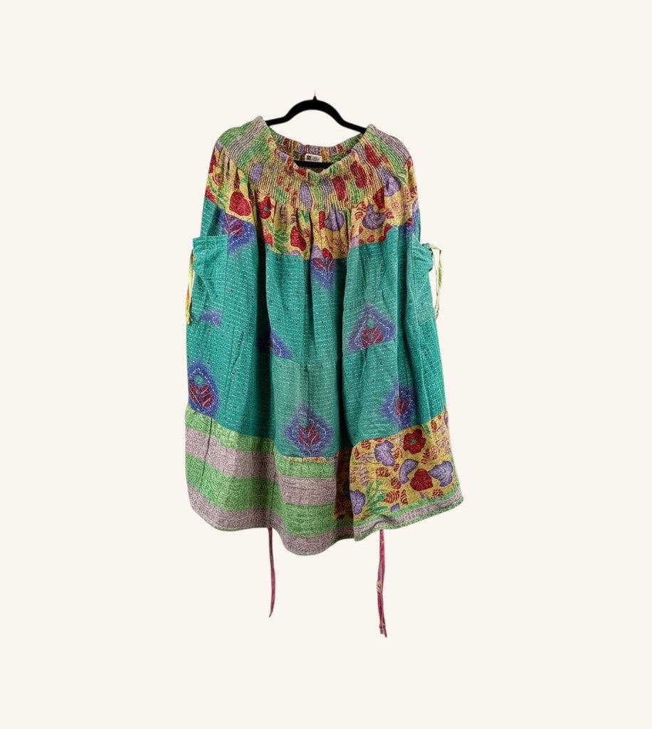 She Lives Beauty Earthbound midi kantha skirt in teal vintage cotton with floral patterns and adjustable leg cinches.