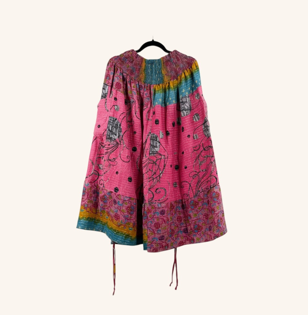She Lives Beauty Earthbound midi skirt in pink vintage kantha cotton with adjustable front leg cinches and floral print.