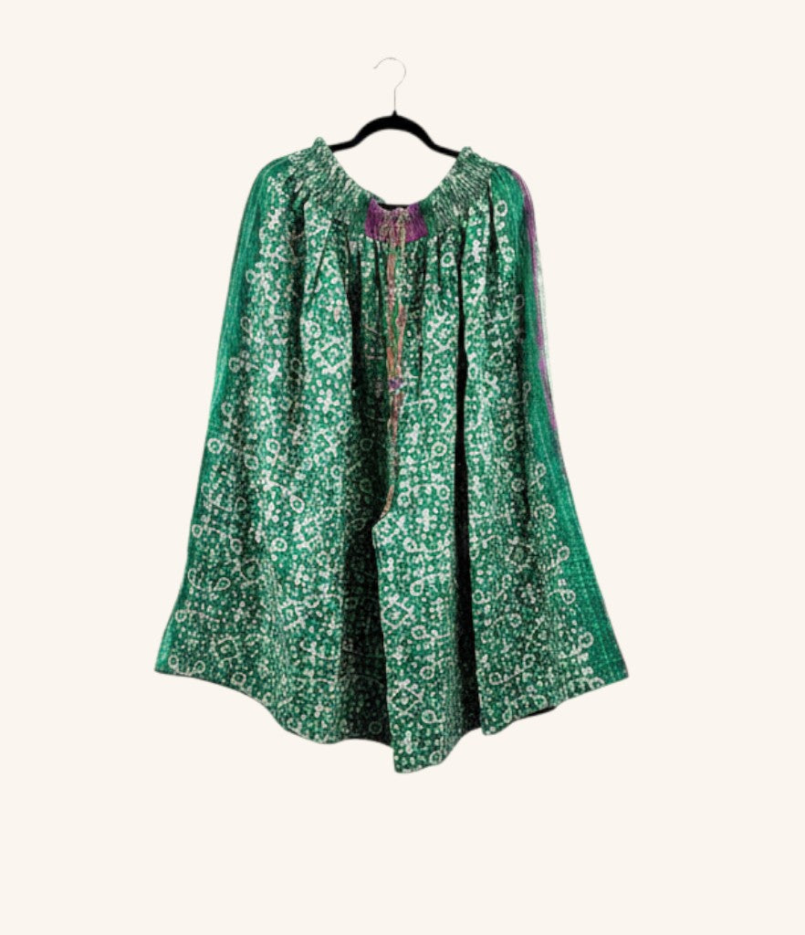 She Lives Beauty Pachuco Kantha capri pants in green vintage cotton with intricate white patterns and pleated design.