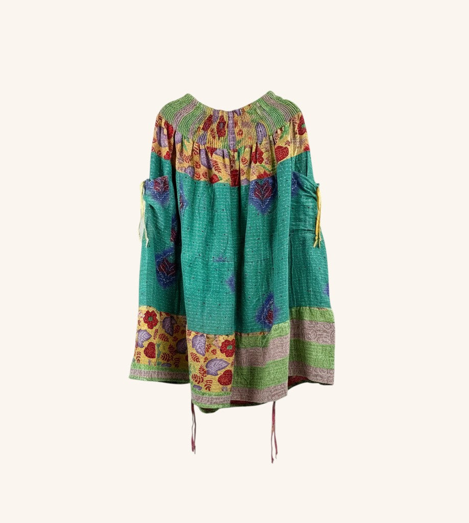 She Lives Beauty Earthbound midi kantha skirt in green vintage cotton with floral patterns and adjustable leg cinches.
