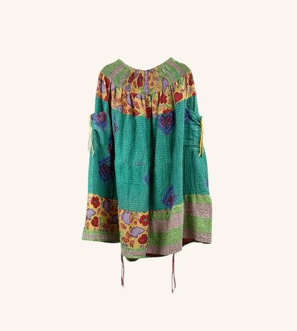 She Lives Beauty Earthbound midi kantha skirt in green vintage cotton with floral patterns and adjustable leg cinches.