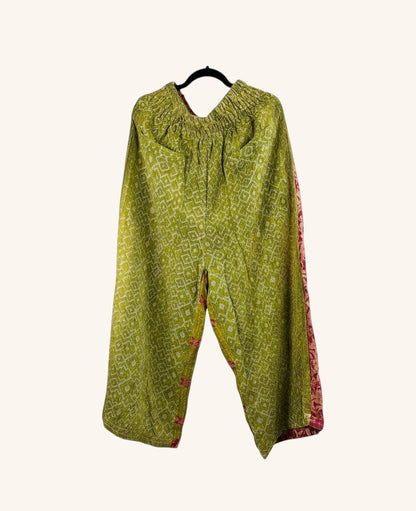 She Lives Beauty wide-leg pants in green vintage kantha cotton with patchwork details and an elastic waistband.