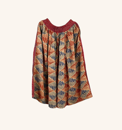 She Lives Beauty Pachuco Kantha capri pants in vintage cotton with a red, blue, and tan leaf print and pleated waist.