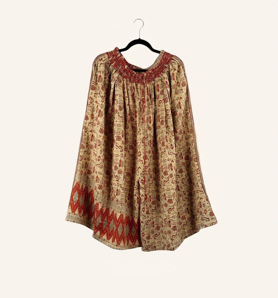 She Lives Beauty Pachuco Kantha capri pants in vintage cotton with red and beige bohemian patterns and pleated details.