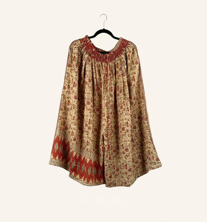 She Lives Beauty Pachuco Kantha capri pants in vintage cotton with red and beige bohemian patterns and pleated details.