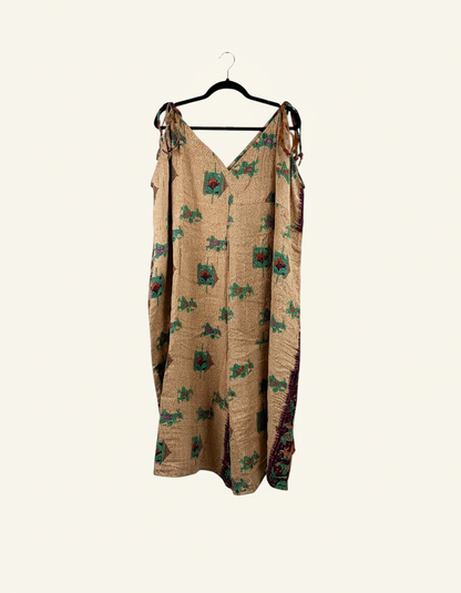 She Lives Beauty Sacred Journey Kantha jumpsuit in tan vintage cotton with green and red floral embroidery details.