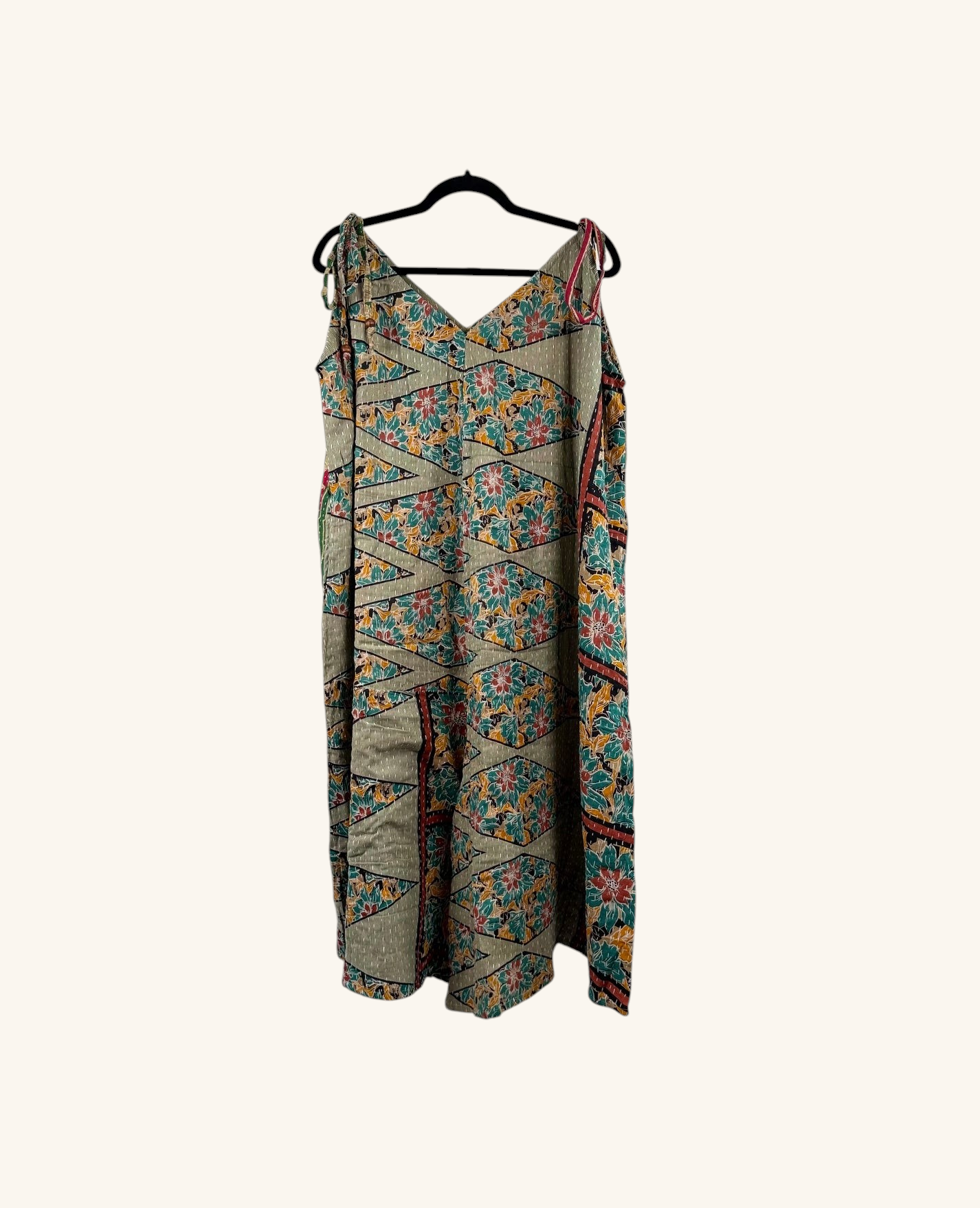 She Lives Beauty Sacred Journey Kantha jumpsuit in vintage cotton with colorful floral patterns and adjustable straps.