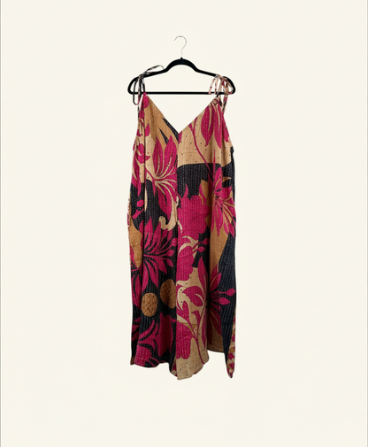 She Lives Beauty Sacred Journey Kantha Jumpsuit in vintage cotton with pink and black floral patterns and side pockets.