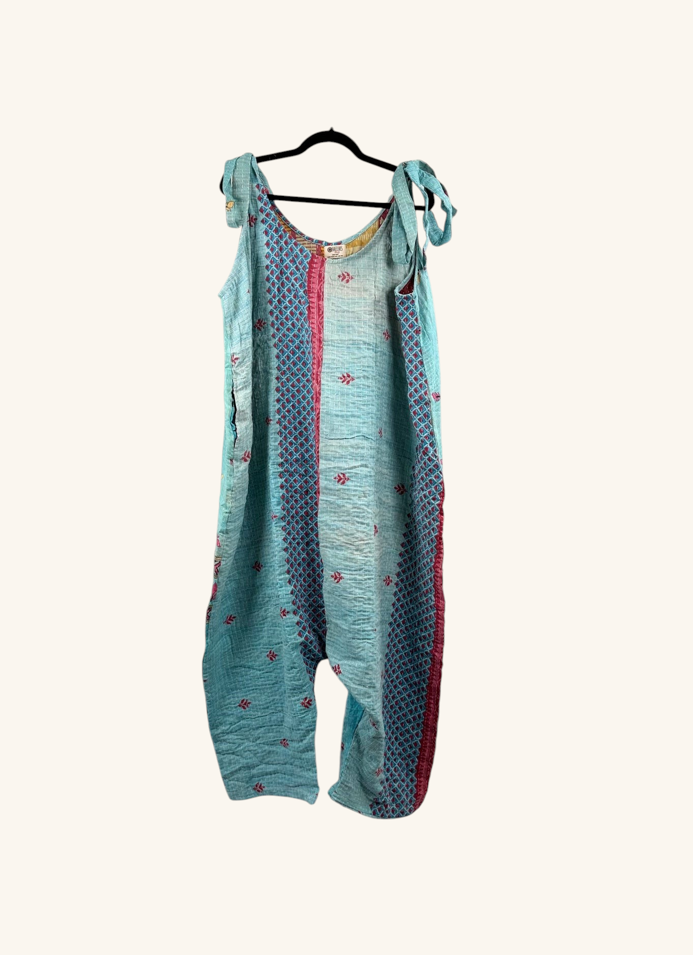 She Lives Beauty Becoming Wild harem jumpsuit in turquoise vintage kantha cotton with red patterned side panels.