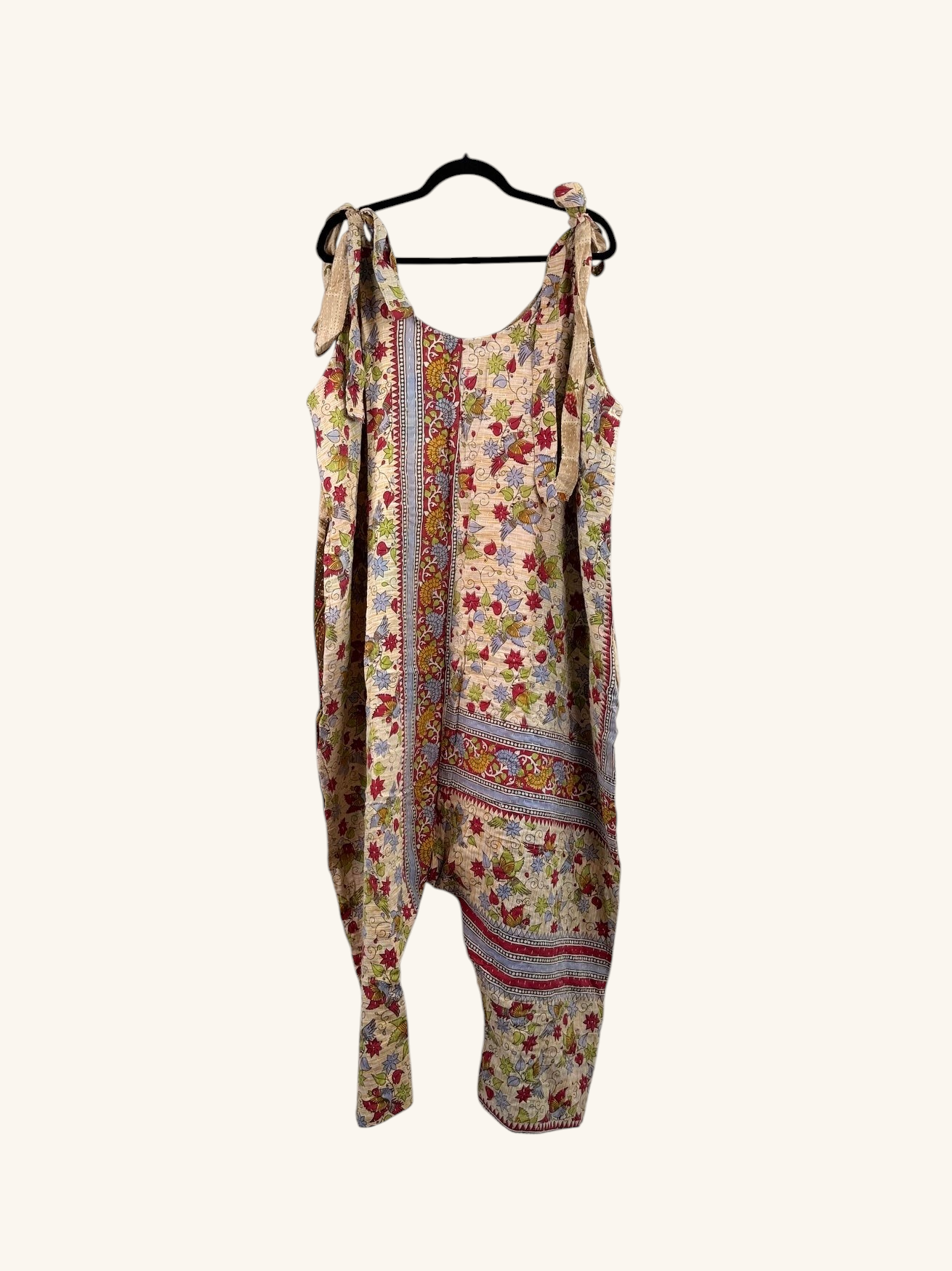 She Lives Beauty Becoming Wild harem jumpsuit in vintage floral kantha cotton with tie shoulders and relaxed fit.
