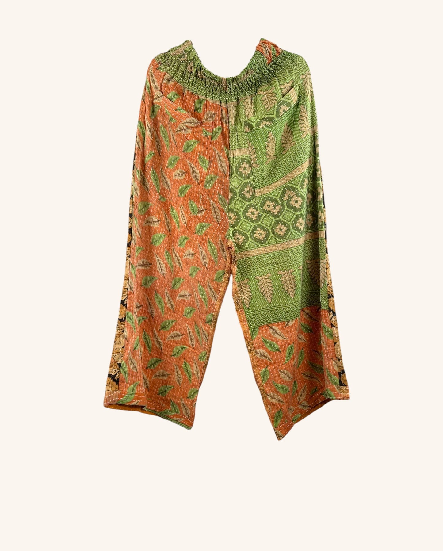 She Lives Beauty Everyday Amaya wide-leg pants made from vintage patchwork Kantha cotton in orange and green leaf prints.