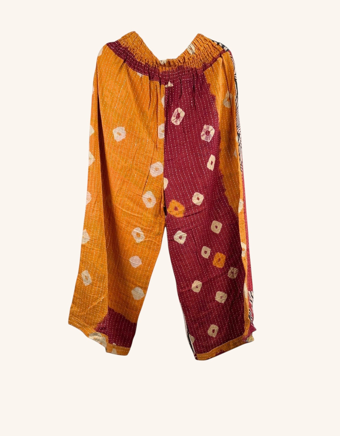 She Lives Beauty Everyday Amaya wide-leg pants in patchwork orange and maroon vintage kantha cotton with hand-stitching.