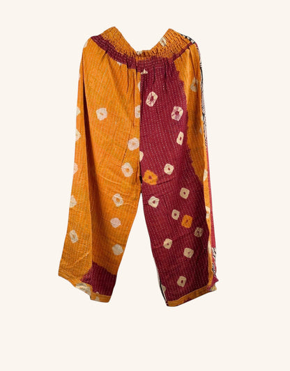 She Lives Beauty Everyday Amaya wide-leg pants in patchwork orange and maroon vintage kantha cotton with hand-stitching.