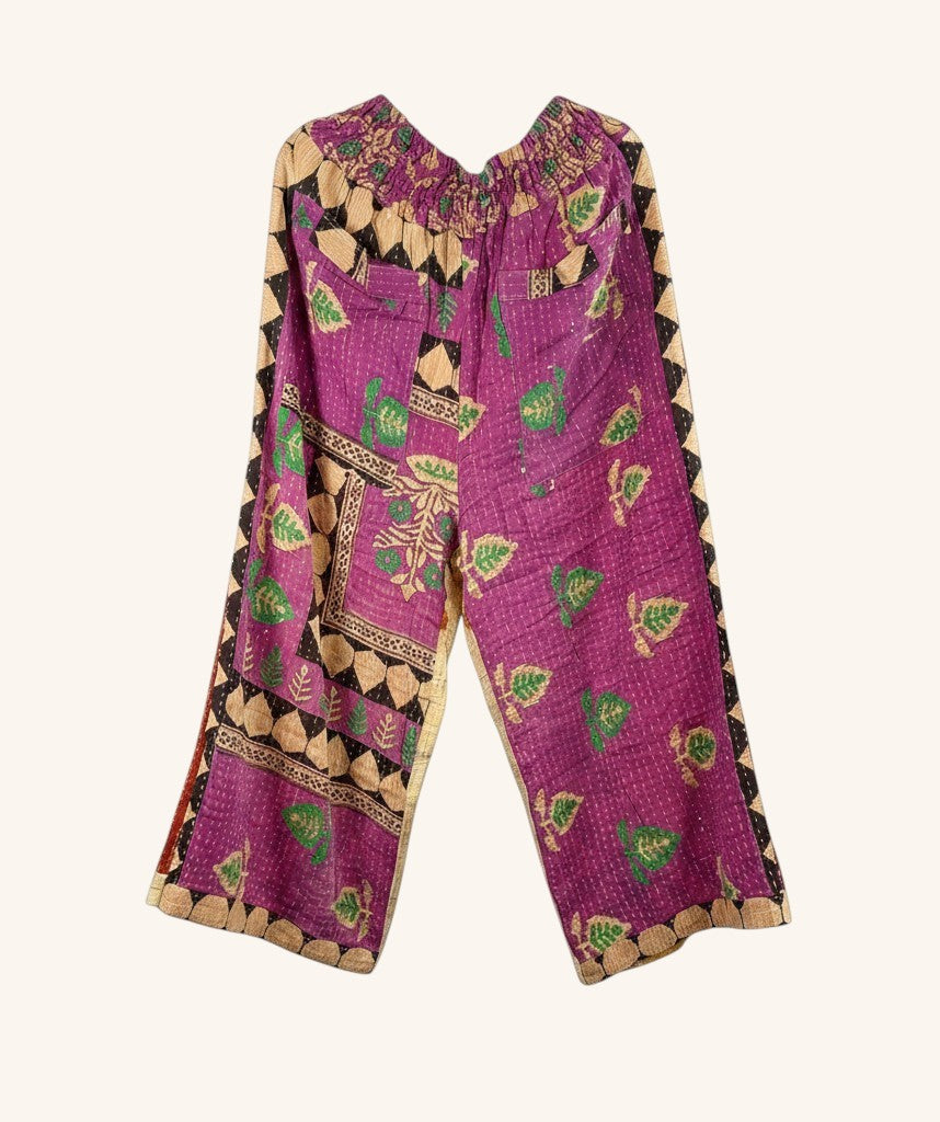 She Lives Beauty wide-leg pants in purple vintage kantha cotton with green leaf patterns and elastic waistband.
