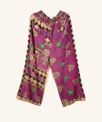 She Lives Beauty wide-leg pants in purple vintage kantha cotton with green leaf patterns and elastic waistband.