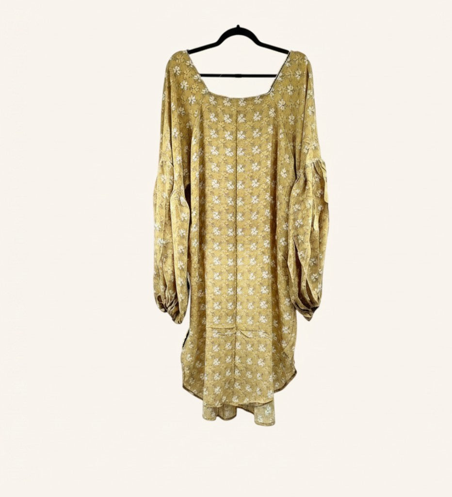 She Lives Beauty Desert Rain silk top in mustard yellow with white floral print, oversized ruffle sleeves, and hi-low hem