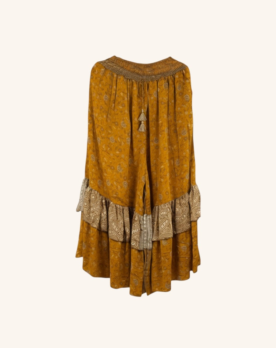 She Lives Beauty Gypsy Moon silk pants in mustard yellow with vintage rasgulla patterns and double ruffled hem detail.