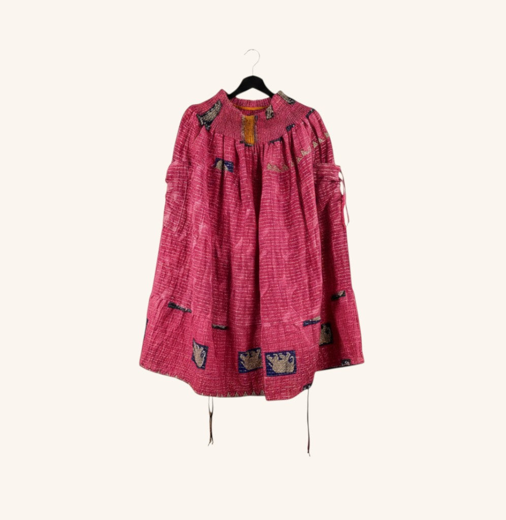 She Lives Beauty Earthbound midi skirt in pink vintage kantha cotton with adjustable front leg cinches on a hanger