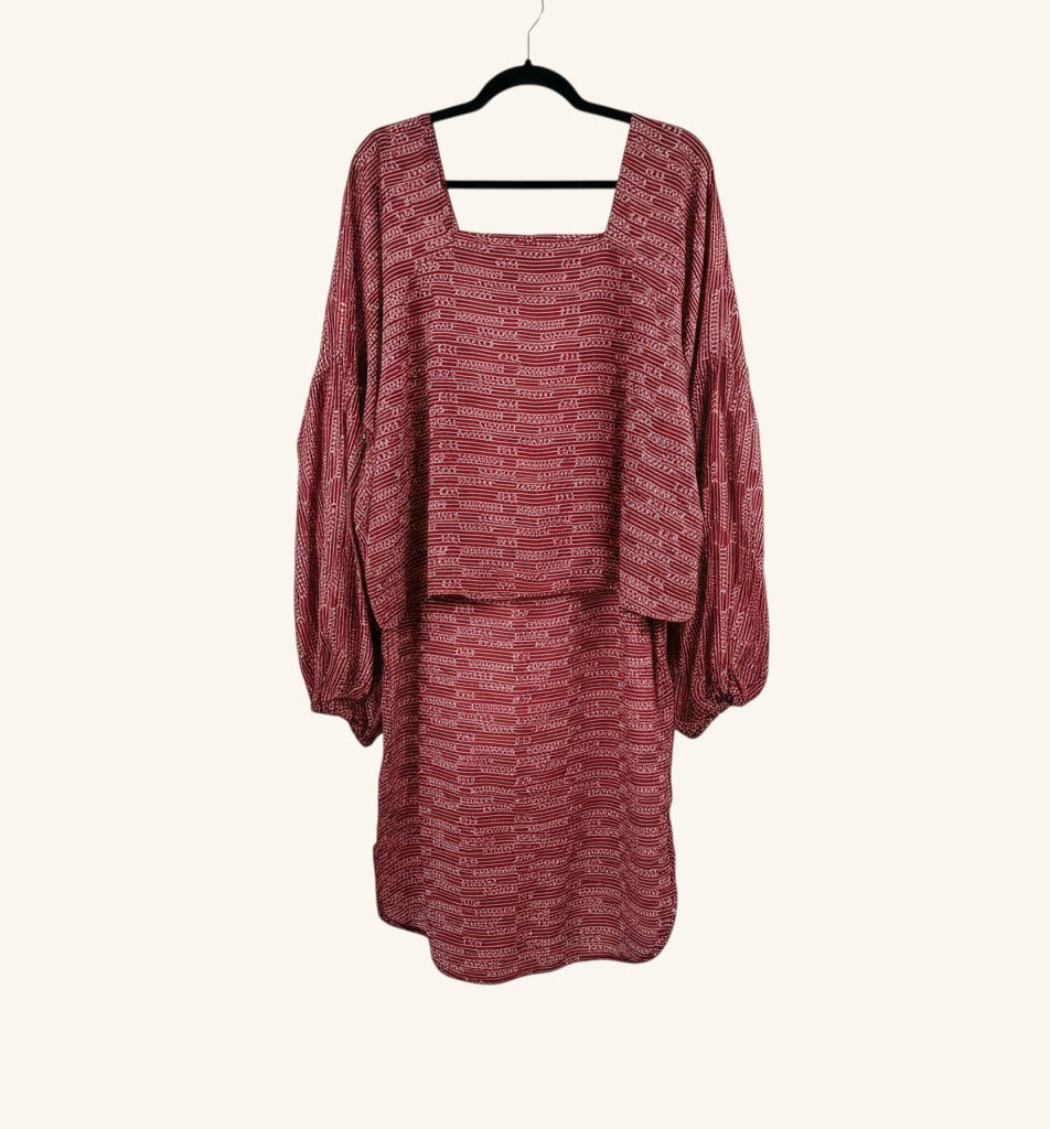 She Lives Beauty Desert Rain silk top in red with kantha stitching, square neckline, and oversized ruffle sleeves.
