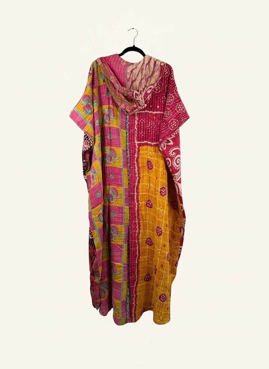She Lives Beauty reversible dahlia jumpsuit made from vintage kantha cotton saris in vibrant pink and yellow patterns.