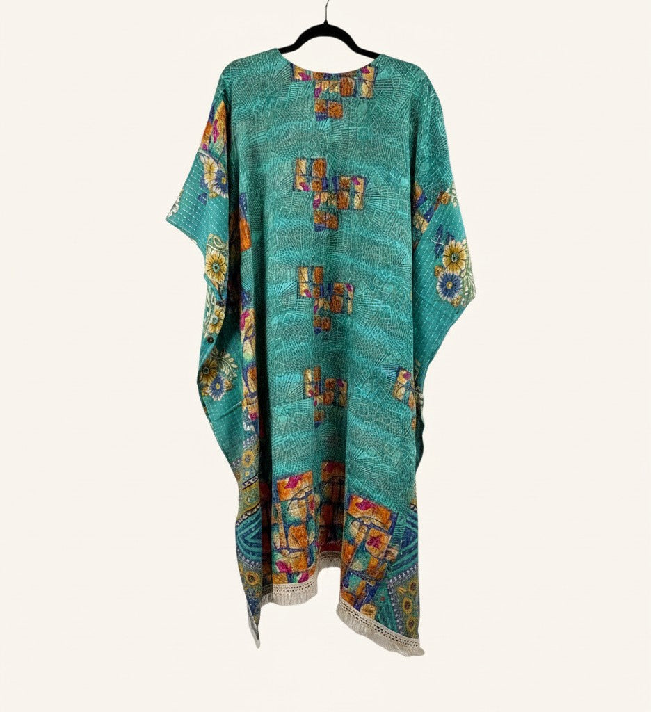 She Lives Beauty La Isla Bonita reversible Kantha top in teal vintage cotton with floral patterns and fringe hem