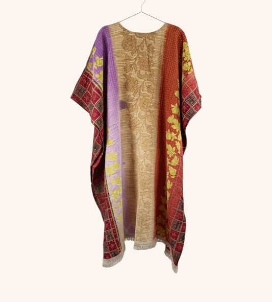 She Lives Beauty reversible Kantha top in multi-colored vintage cotton with floral patterns and fringe hem detail.