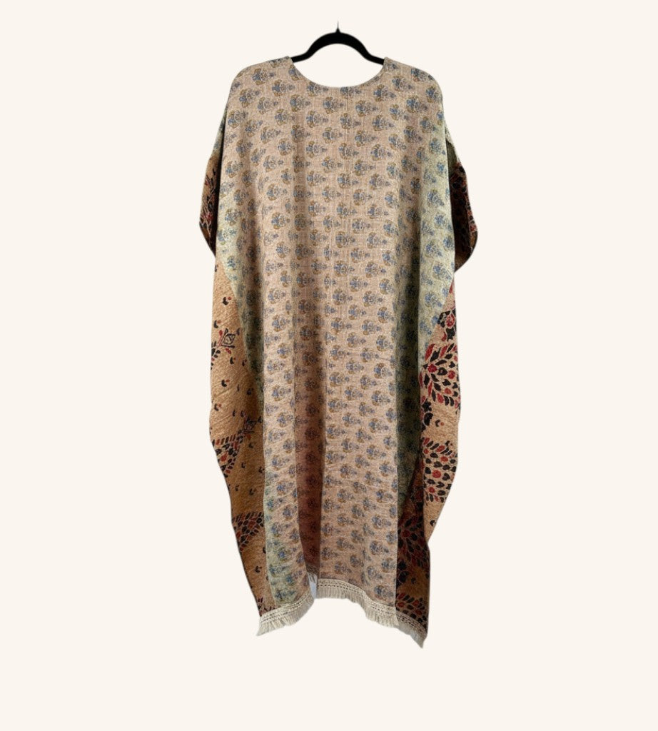 She Lives Beauty reversible Kantha top in vintage cotton with floral patterns, hi-low hem, and fringe detailing.