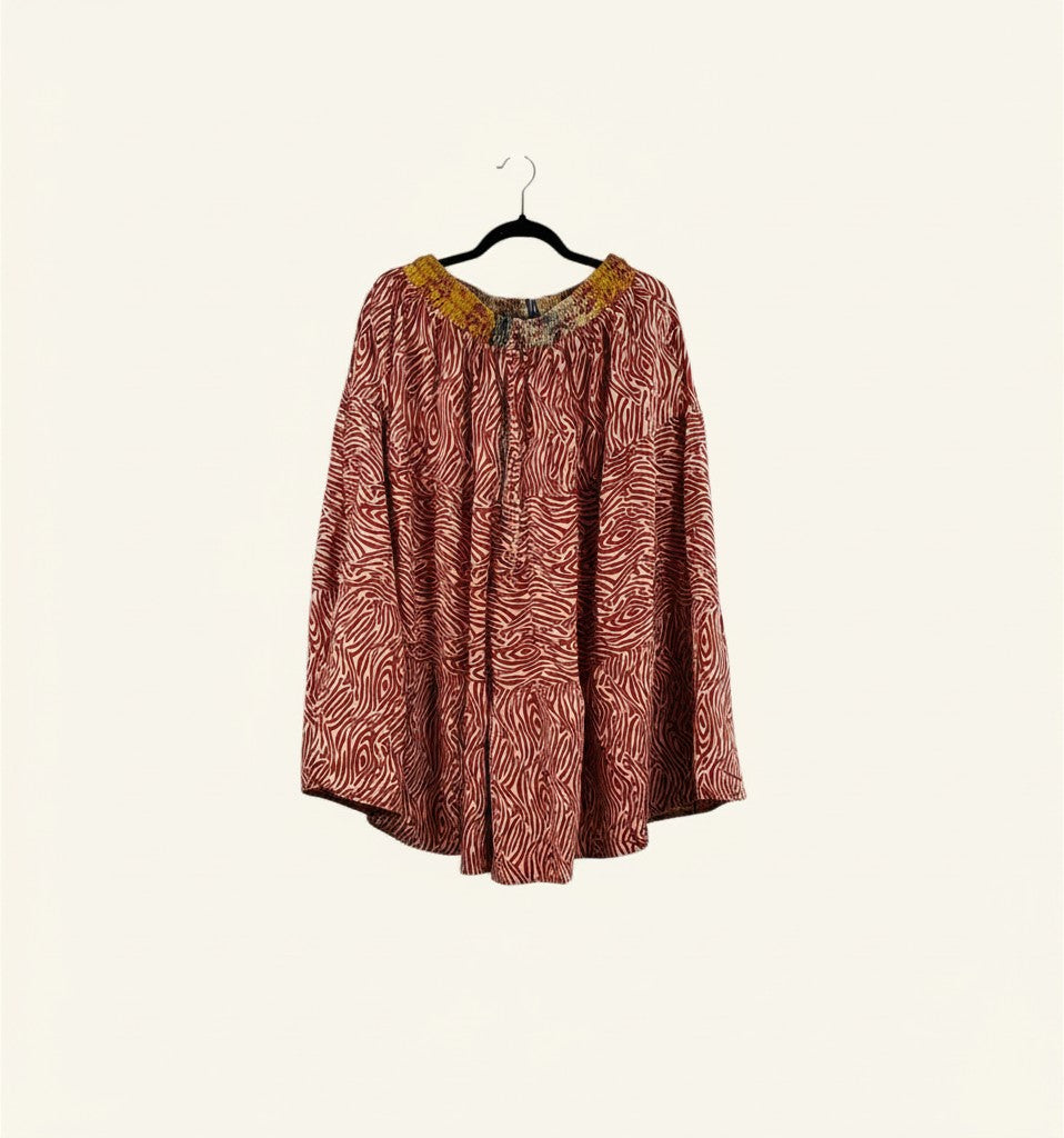 She Lives Beauty Earth Song reversible capri pants in red and white patterned vintage silk and cotton on a hanger