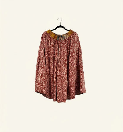She Lives Beauty Earth Song reversible capri pants in red and white patterned vintage silk and cotton on a hanger
