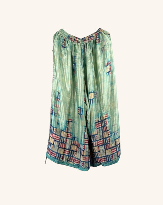 She Lives Beauty vintage rasgulla silk wide leg jogger pants in light green with blue and red patchwork patterns.