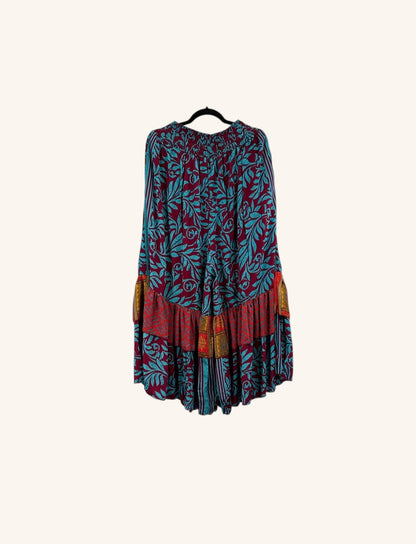 She Lives Beauty Gypsy Moon silk ruffle pants in a bohemian floral print with deep red and teal tones.