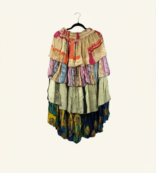 She Lives Beauty vintage rasgulla silk hi-lo skirt with cascading ruffles and colorful patterned panels.