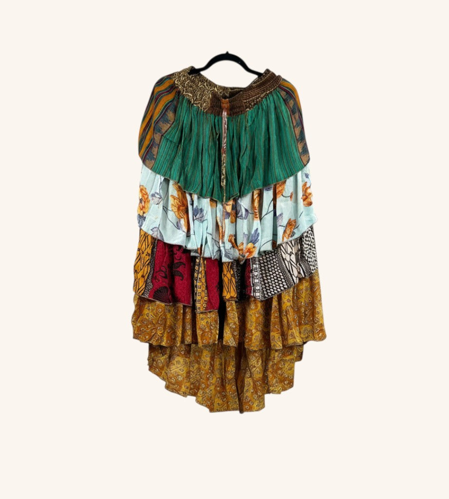 She Lives Beauty vintage Rasgulla silk hi-lo skirt with colorful tiered ruffles and bohemian floral patterns.