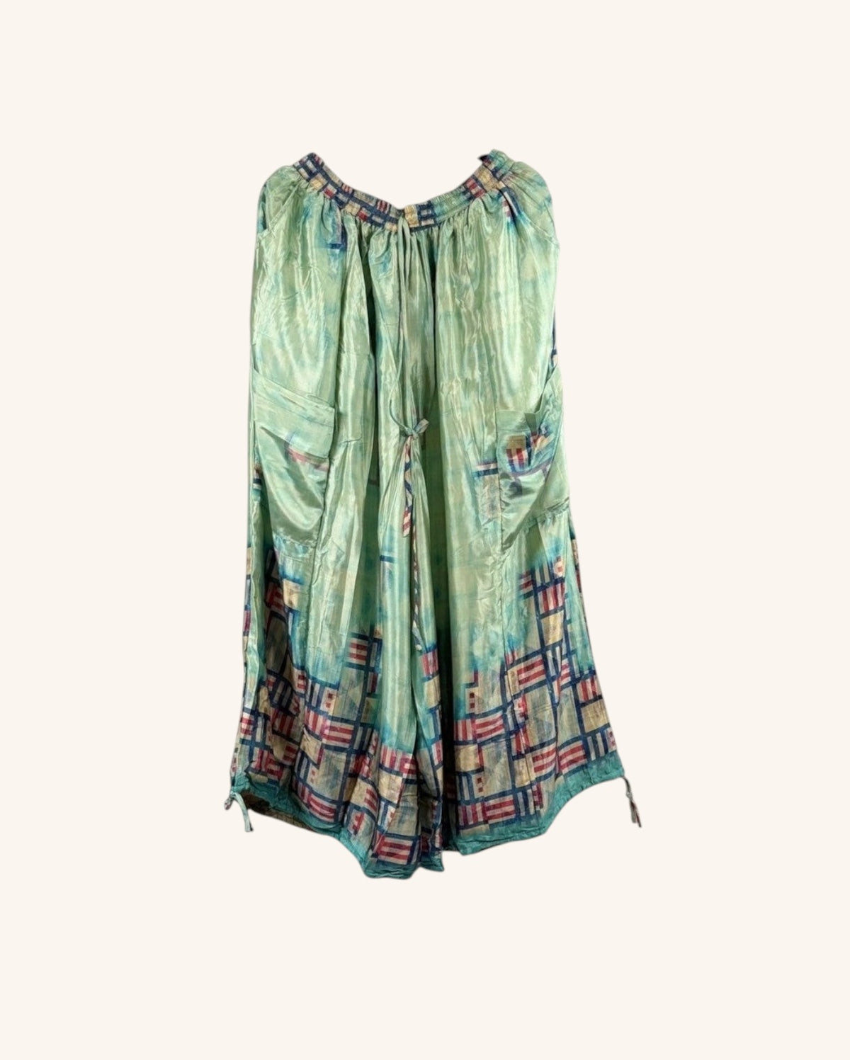 She Lives Beauty vintage rasgulla silk wide leg jogger pants in light green with a geometric patchwork hem pattern.