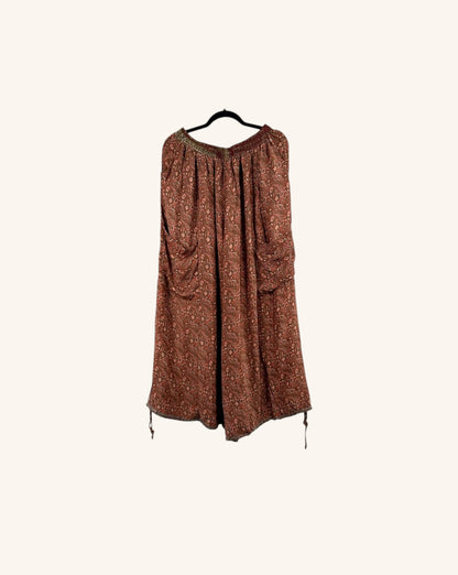 She Lives Beauty vintage rasgulla silk wide leg jogger pants in a patterned rust brown boho style