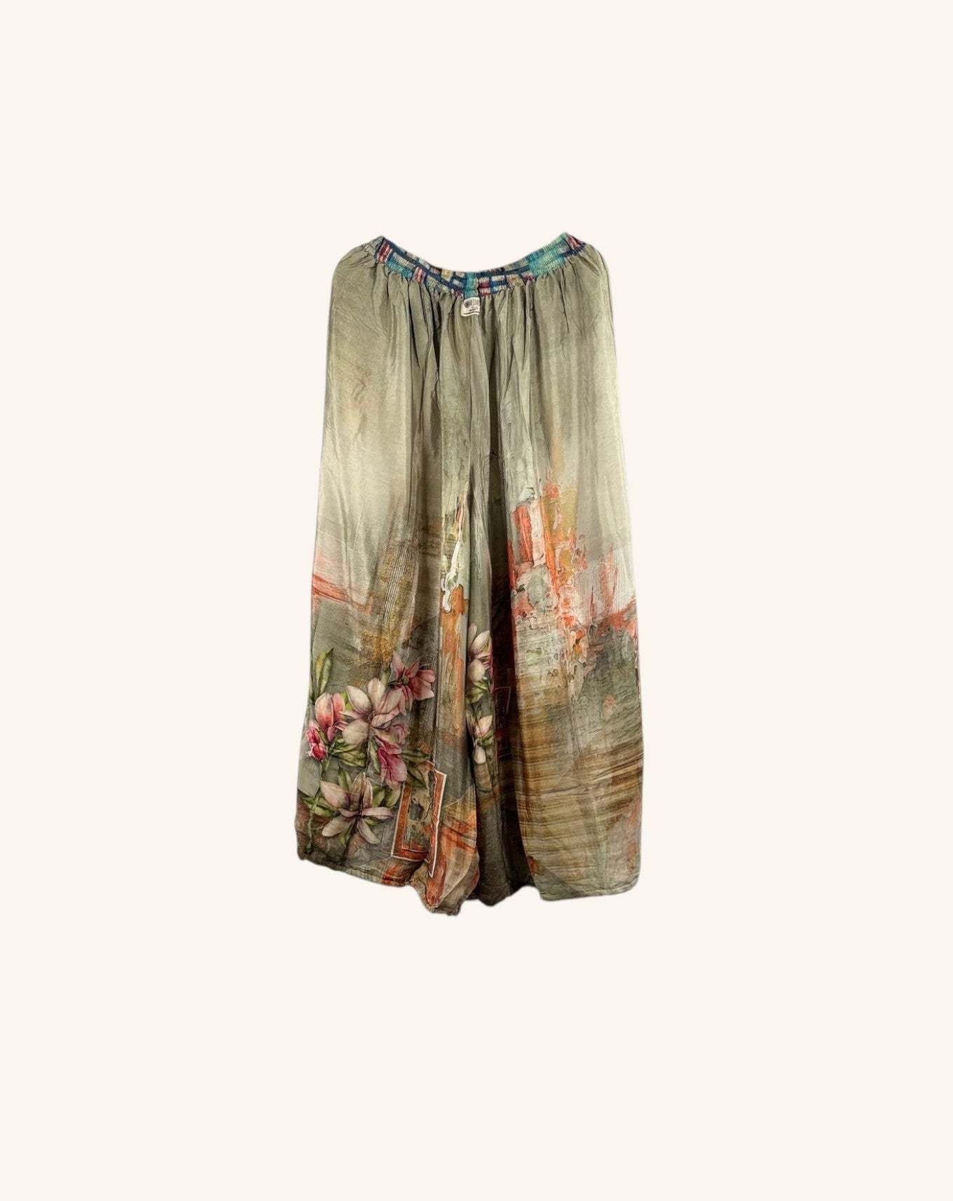 She Lives Beauty vintage rasgulla silk wide leg nomad pants with floral patchwork patterns in muted earth tones.