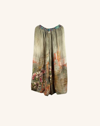 She Lives Beauty vintage rasgulla silk wide leg nomad pants with floral patchwork patterns in muted earth tones.