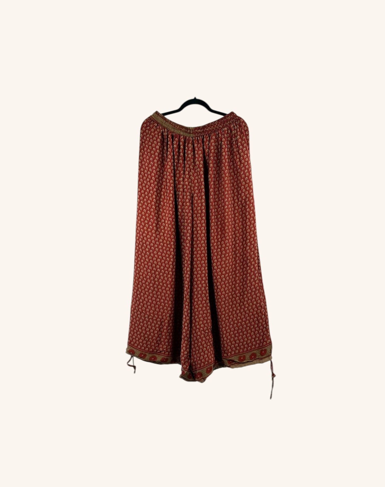 She Lives Beauty vintage rasgulla silk wide leg pants in a deep red floral print with a relaxed, flowing silhouette.