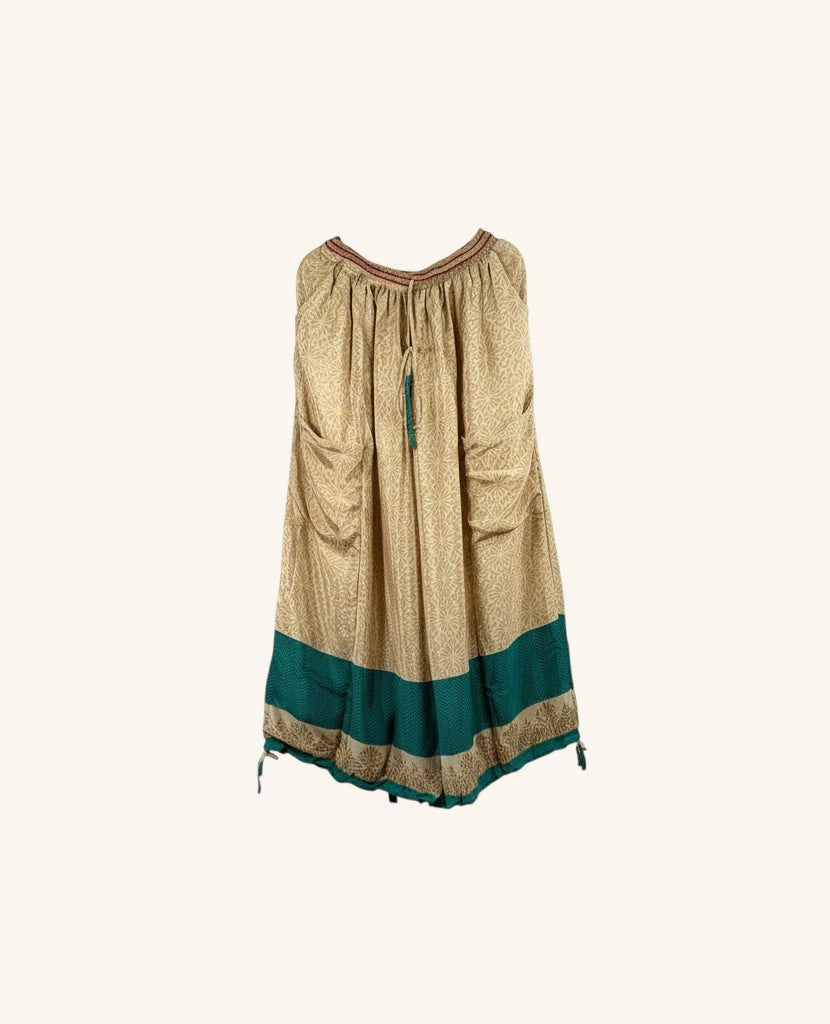 She Lives Beauty vintage silk wide leg pants in beige with a teal hem and drawstring waist.