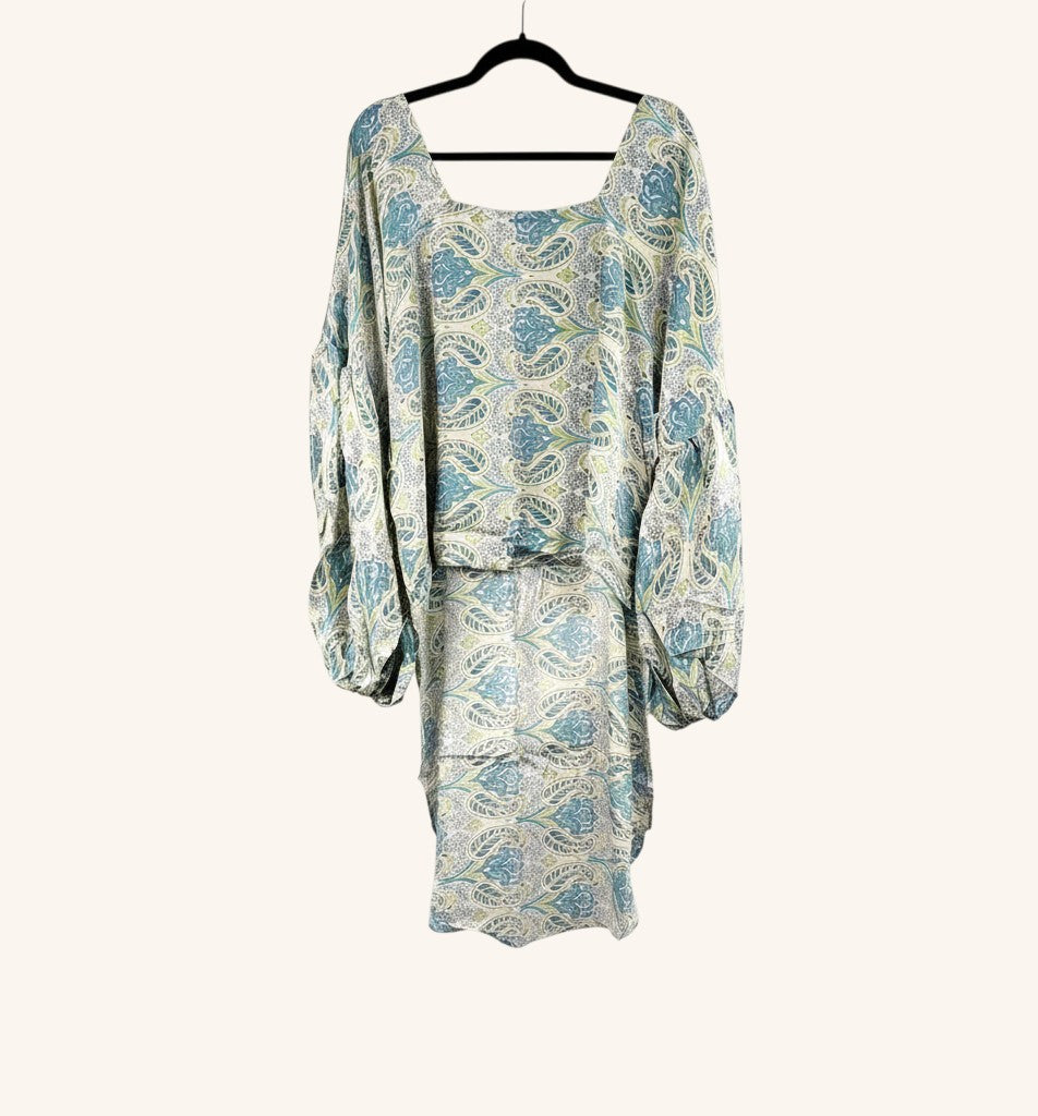 She Lives Beauty Desert Rain silk top featuring a blue and cream vintage paisley print with oversized ruffle sleeves.
