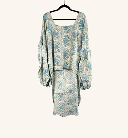 She Lives Beauty Desert Rain silk top featuring a blue and cream vintage paisley print with oversized ruffle sleeves.