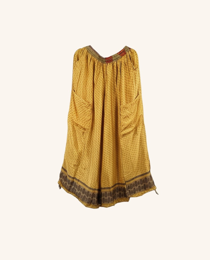 She Lives Beauty vintage rasgulla silk wide leg pants in mustard yellow with intricate brown patterned border and pockets