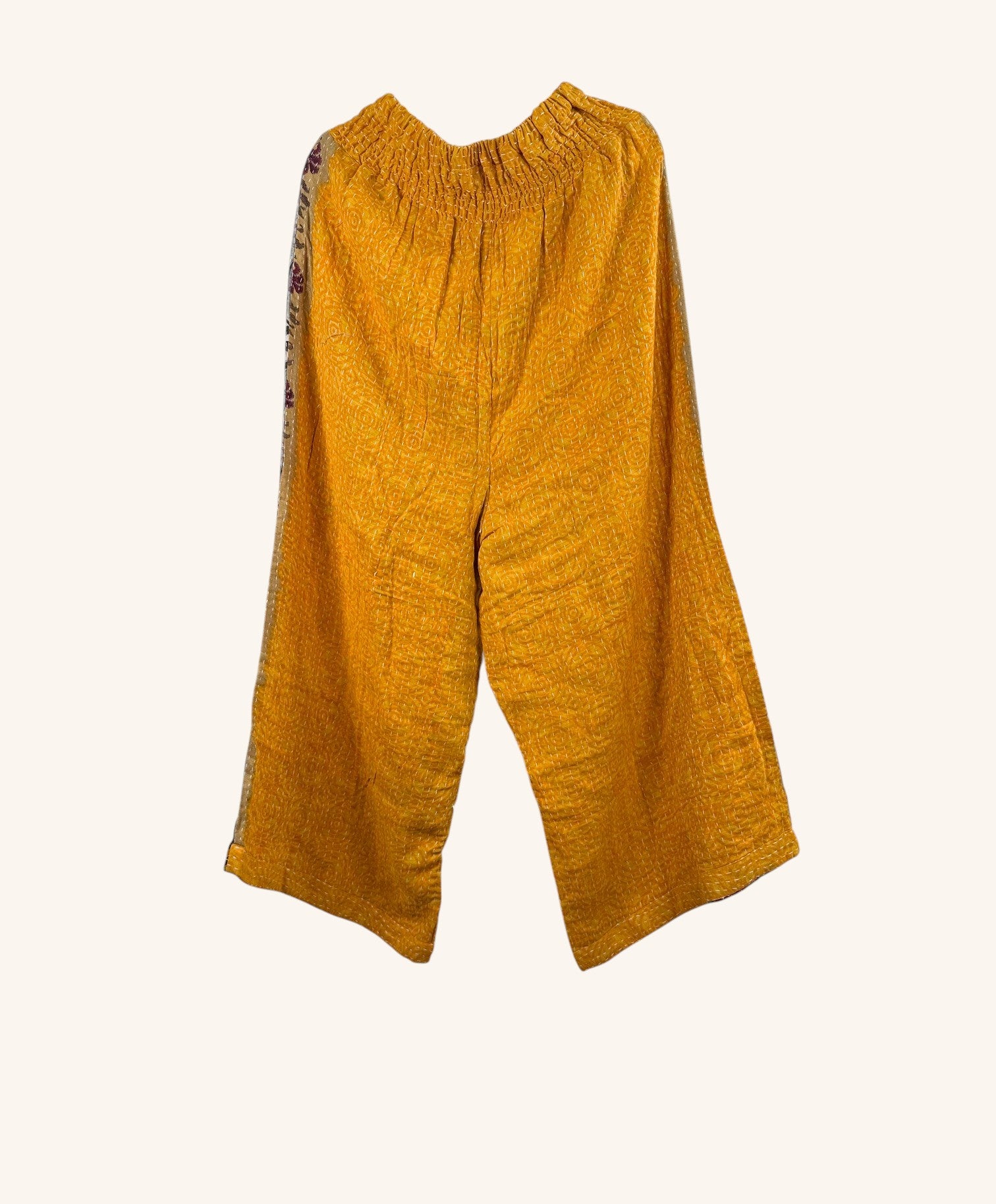 She Lives Beauty yellow wide leg Kantha pants made from vintage cotton with hand-stitched details and elastic waist.